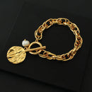 Pulseira em Elos Torcidos e Pingente